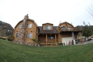 Read more about the article Property Id: CA-14 – Experience a Luxury Mountain Getaway: Stunning Log Home on 22 Private Acres